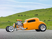 AUT 26 RK2980 01
1934 Chevrolet Coupe Hot Rod Orange 3/4 Front View On Pavement By Grassy Hill