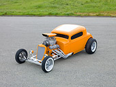 AUT 26 RK2982 01
1934 Chevrolet Coupe Hot Rod Orange 3/4 Front View On Pavement By Grassy Hill