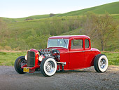 AUT 26 RK3022 01
1932 Ford 5 Window Coupe Red 3/4 Front View On Gravel By Grassy Hills And Trees