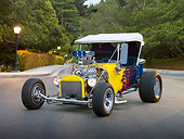 AUT 26 RK3041 01
1923 Ford T-Bucket Hot Rod Blue With Yellow Flames 3/4 Front View On Pavement By Trees And Street Lamps