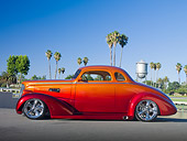 AUT 26 RK3064 01
1937 Chevrolet Coupe Candy Red And Tangerine Profile View On Pavement By Palm Trees And Water Tower