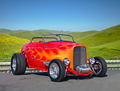 AUT 26 RK3071 01
1932 Ford Roadster Red With Orange Flames 3/4 Front View On Pavement By Grassy Hills