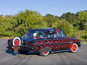 AUT 26 RK3084 01
1963 Ford Falcon Rat Rod Black With Red Graphics 3/4 Rear View On Pavement By Trees