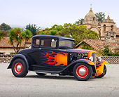 AUT 26 RK3113 01
1931 Ford Model A Black With Orange Flames 3/4 Side View On Pavement By Old Buildings