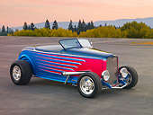AUT 26 RK3218 01
1932 Ford Roadster Multi-Colored 3/4 Front View On Pavement By Trees