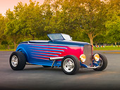 AUT 26 RK3220 01
1932 Ford Roadster Multi-Colored 3/4 Front View On Pavement By Trees