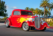 AUT 26 RK3241 01
1934 Chevrolet 3-Window Coupe Red With Flames 3/4 Front View On Pavement By Palm Trees