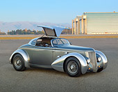 AUT 26 RK3298 01
1936 Ford AeroSport Silver 3/4 Front View On Pavement By Hangars