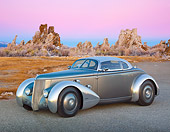 AUT 26 RK3299 01
1936 Ford AeroSport Silver 3/4 Front View On Pavement In Desert At Dusk