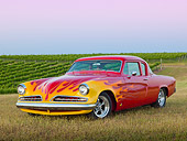 AUT 26 RK3332 01
1954 Studebaker Champion Coupe Hot Rod Red With Flames 3/4 Front View On Grass By Vineyard