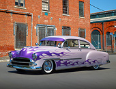 AUT 26 RK3339 01
1951 Chevrolet Fleetline Purple With Flames 3/4 Side View On Pavement By Brick Building