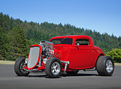 AUT 26 RK3354 01
1934 Ford Coupe Hot Rod Red With Flames 3/4 Front View On Pavement By Evergreen Trees