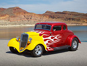 AUT 26 RK3364 01
1934 Ford 5 Window Coupe Red With Flames 3/4 Front View On Pavement By Lake In Desert