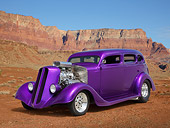 AUT 26 RK3366 01
1936 Dodge 4 Door Sedan Candy Purple 3/4 Front View On Dirt In Desert