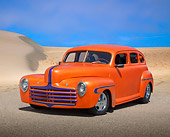 AUT 26 RK3368 01
1946 Ford Sedan Hot Rod Orange 3/4 Front View On Pavement By Sand Dunes