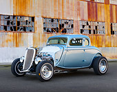 AUT 26 RK3369 01
1934 Ford 5-Window Coupe Blue 3/4 Front View On Pavement By Old Factory Building