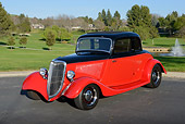 AUT 26 RK3376 01
1934 Ford Coupe Red And Black 3/4 Front View On Pavement By Golf Course