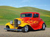 AUT 26 RK3379 01
1932 Ford 3 Window Coupe Red With Flames 3/4 Front View On Gravel By Grassy Hills