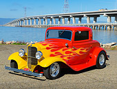AUT 26 RK3380 01
1932 Ford 3 Window Coupe Red With Flames 3/4 Front View On Gravel By Bridge