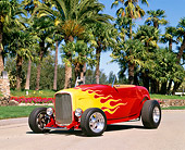 AUT 26 RK0031 02
1932 Ford Hi-Boy Roadster Red And Yellow 3/4 Front View By Palm Trees