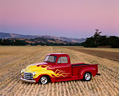 AUT 26 RK0043 04
1952 Chevrolet Pickup Red Yellow Flames 3/4 Front View In Farm Field