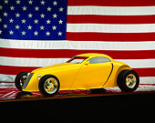 AUT 26 RK0059 02
Aluma Coupe Yellow 3/4 Side View American Flag Background