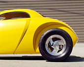 AUT 26 RK0062 02
Aluma Coupe Hot Rod Yellow Profile Close Up Of Rear Wheel