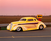 AUT 26 RK0193 02
1937 Chevrolet Coupe Yellow 3/4 Front View On Pavement By Field Filtered