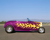 AUT 26 RK0217 20
1932 Ford Hi-Boy Roadster Purple With Flames Profile View On Pavement Blue Sky