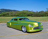 AUT 26 RK0230 04
1948 Buick Roadmaster Custom Green 3/4 Front View On Pavement By Grass And Bushes