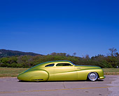 AUT 26 RK0233 01
1948 Buick Roadmaster Custom Green Profile On Pavement By Grass Bushes Blue Sky