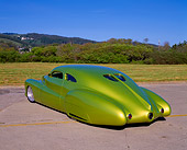 AUT 26 RK0235 09
1948 Buick Roadmaster Custom Green 3/4 Rear View On Pavement By Grass And Bushes