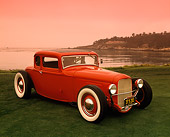 AUT 26 RK0253 03
1932 Ford Coupe Red 3/4 Side View On Grass By Water Red Sky