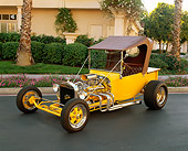 AUT 26 RK0267 05
1923 Ford T Bucket Yellow Brown Top 3/4 Front View On Pavement Bushes And Grass