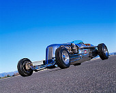 AUT 26 RK0282 01
Blastolene Special Concept Race Car Low Slanted 3/4 Front View On Pavement Blue Sky