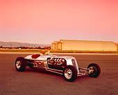AUT 26 RK0304 04
Blastolene Special Concept Race Car With Driver 3/4 Front View On Pavement Airplane Hanger Filtered