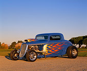 AUT 26 RK0338 01
1934 Ford 3 Window Coupe Blue With Flames 3/4 Front View On Gravel Blue Sky