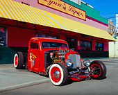 AUT 26 RK0364 02
1937 Chevrolet Rat Rod Red 3/4 Front View On Pavement By Store
