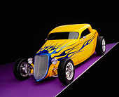 AUT 26 RK0385 04
2004 Speed Star Coupe Yellow Blue Flames 3/4 Front View On Purple Floor Gray Line Studio