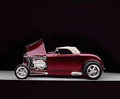 AUT 26 RK0397 05
1932 Ford Custom Roadster Burgundy Profile View On Gray Floor Hood Open Studio