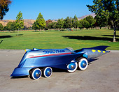 AUT 26 RK0431 05
1997 Soul Train Car Silver Front 3/4 View On Pavement By Grass And Trees