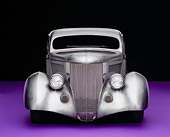 AUT 26 RK0506 01
1936 Ford Cole Foster 3 Window Coupe Raw Silver Head On Shot On Purple Floor Studio