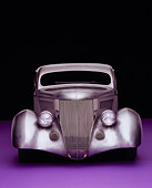 AUT 26 RK0506 10
1936 Ford Cole Foster 3 Window Coupe Raw Silver Head On Shot On Purple Floor Studio
