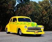 AUT 26 RK0519 03
1947 Mercury Coupe Yellow With Green Flames Low 3/4 Front View On Pavement Trees Background