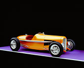 AUT 26 RK0523 01
2005 Zane Speedster Orange Side 3/4 View On Purple Floor Gray Line Studio