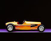 AUT 26 RK0524 03
2005 Zane Speedster Orange Profile View On Purple Floor Gray Line Studio