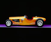 AUT 26 RK0525 03
2005 Zane Speedster Orange Profile View On Purple Floor Gray Line Studio