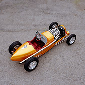AUT 26 RK0529 06
2005 Zane Speedster Orange Overhead 3/4 Rear View On Pavement