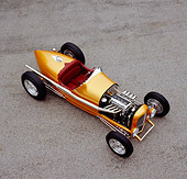 AUT 26 RK0530 04
2005 Zane Speedster Orange Overhead 3/4 Front View On Pavement