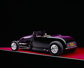 AUT 26 RK0540 06
1929 Ford Track Nose Roadster Black And Cream Rear 3/4 View On Red Floor Studio